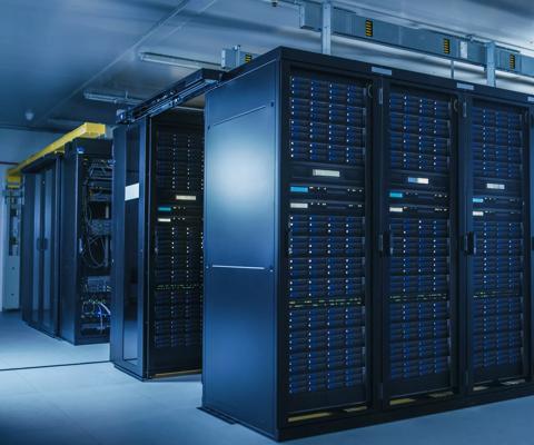 Shot of Modern Data Center With Multiple Rows of Operational Server Racks. Modern High-Tech Database Super Computer Clean Room.