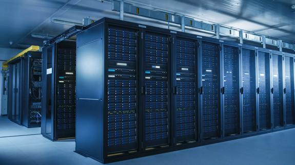 Shot of Modern Data Center With Multiple Rows of Operational Server Racks. Modern High-Tech Database Super Computer Clean Room.