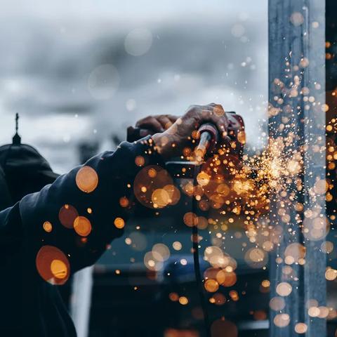 Closeup of welding instrument sparking at a construction site