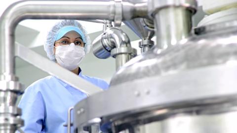 2011Feb-stock-machine-factory-quality-control-healthcare-worker-pharmaceuticals