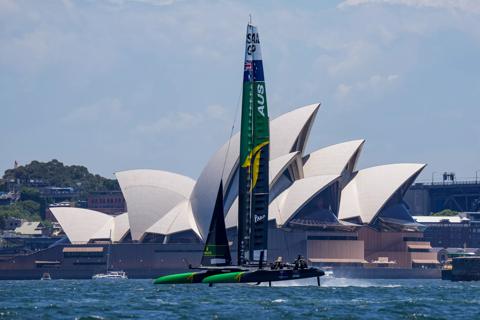 Australia SailGP Team helmed by Tom Slingsby sail past the Sydney Opera House during a practice session ahead of Australia Sail Grand Prix presented by KPMG. 15 December 2021. Photo: Bob Martin for SailGP. Handout image supplied by SailGP