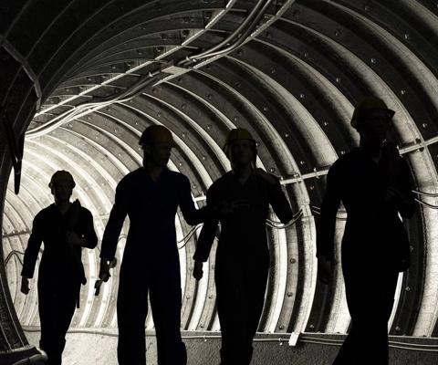 2017-01-silhouette-men-walking-through-tunnel