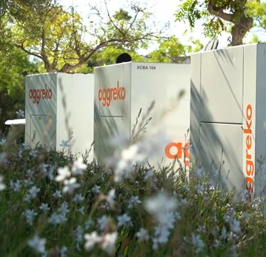 Close-up view of various white Aggreko generators.