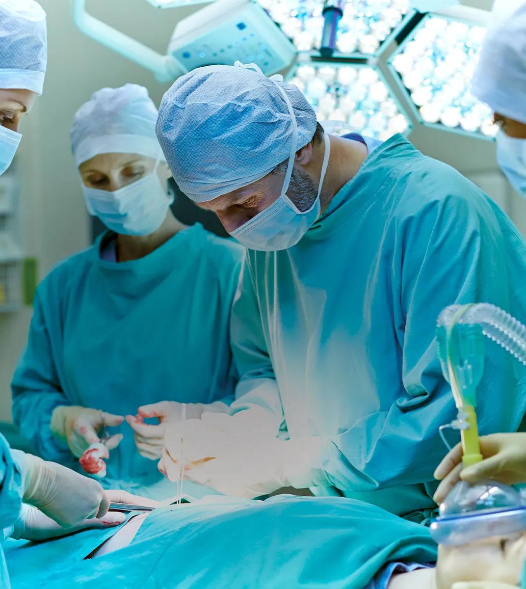 Doctors work on a patient in a surgery room