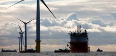 A cable laying vessel laying electricity cable for the Walney offshore wind farm, Barrow in Furness, Cumbria, UK.