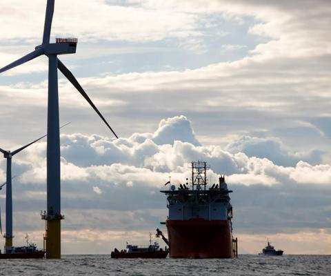 A cable laying vessel laying electricity cable for the Walney offshore wind farm, Barrow in Furness, Cumbria, UK.