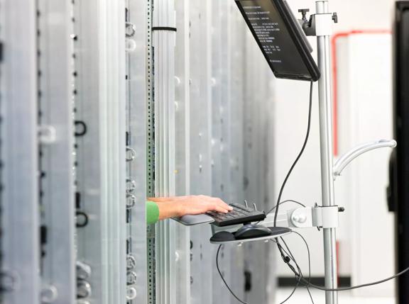 2015Feb-data-center-server-room-computer-technician-working-data_centres-pilot-hero