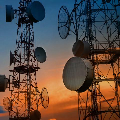 Closeup of a telecommunications tower during sunset.