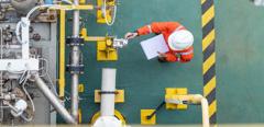 Oil and gas industry activity, operator check and inspect oil pump differential gauge and pressure transmitter as daily log sheet record for monitor production process.