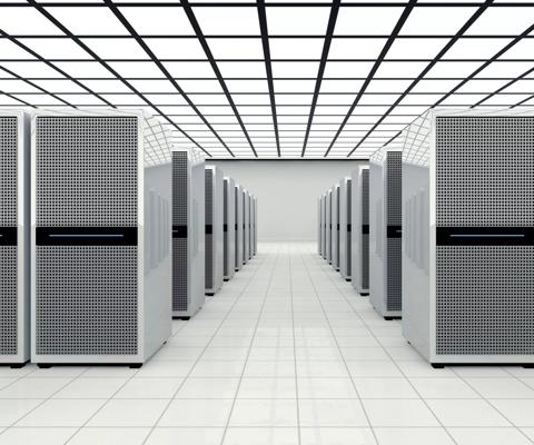 Data center in a large bright room with lots of computer cabinets