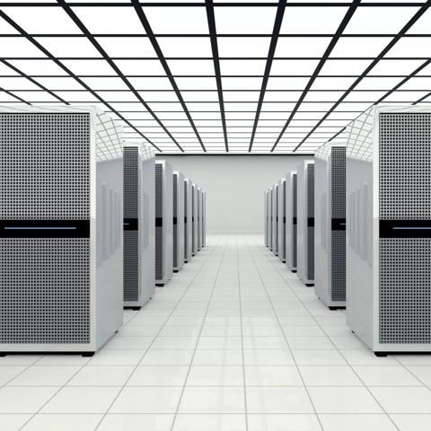 Data center in a large bright room with lots of computer cabinets