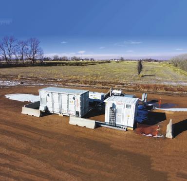 Two white Aggreko batteries at a worksite