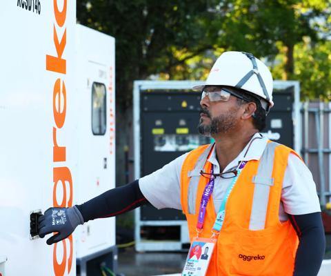 TOKYO JAPAN - SEPTEMBER 17: An employee inspects a generator at Tokyo Stadium on September 17 2019 in Tokyo Japan. (Photo by Ken Ishii/Getty Images for Aggreko)