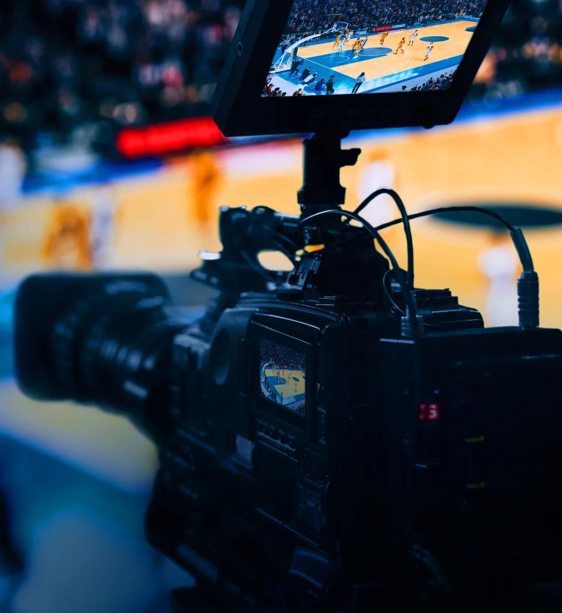 A professional video camera broadcasting a basketball game.