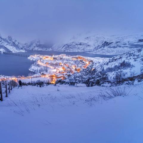 Scenic View Of Lake, Village And Mountains Against Sky with witer storm, Riaño, Castilla y Leon, Spain.