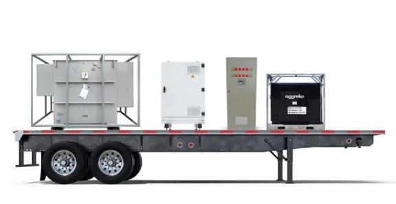 A trailer equipped with three industrial units, including a generator and control box, positioned for transportation.
