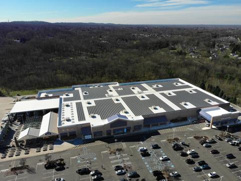 An aerial panoramic view of a large, single-story commercial or retail building.