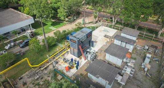 Aerial view of a worksite with black Aggreko gas generators