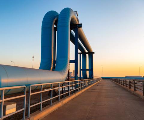 Blue pipes going to oil refinery