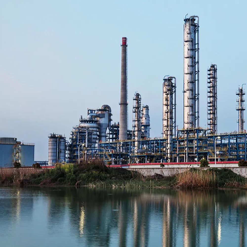 View of a refinery beside a body of water