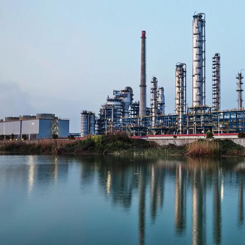 View of a refinery beside a body of water
