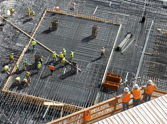 Installing Steel Reinforcement Bars for Concrete Foundation at High-rise Building Site