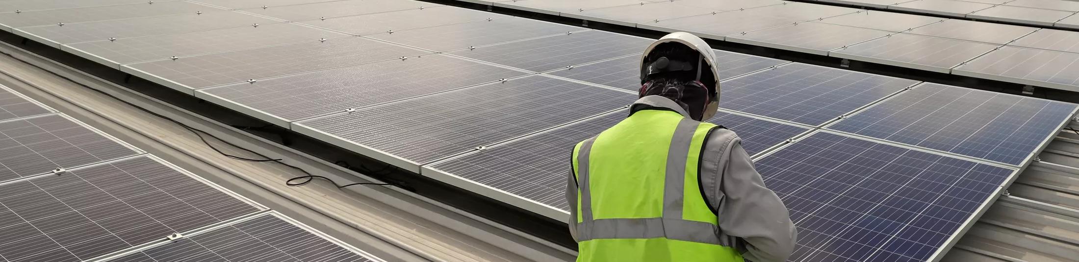 Technician Connecting Cable Solar Rooftop
