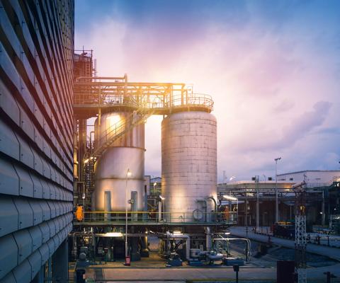 Chemical tanks in petrochemical industry plant or Reactor for chemical reaction in factory with blue sky sunset background