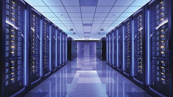 Hallway of servers in a data center with blue and purple tones