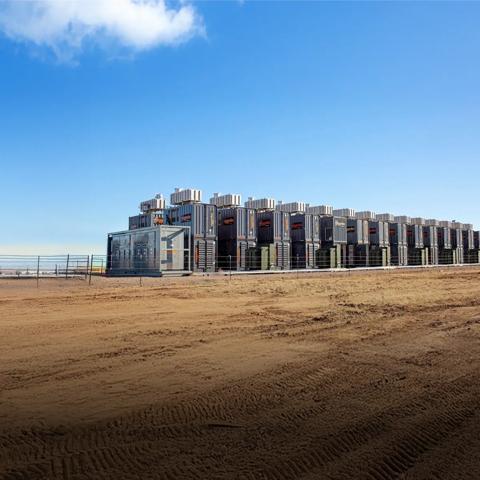 Row of black aggreko generators at a worksite