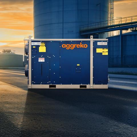 Blue Aggreko heater outdoors of an industrial facility.
