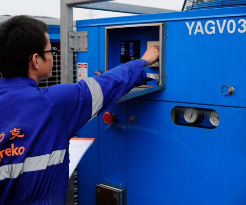 Aggreko technician working on temperature control equipment, China