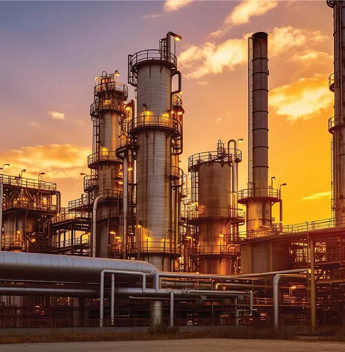 View of a petrochemical plant during sunset.