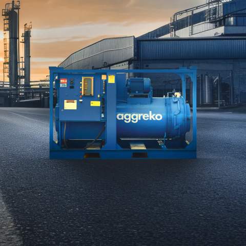 View of a blue Aggreko industrial unit outdoors in an industrial facility.