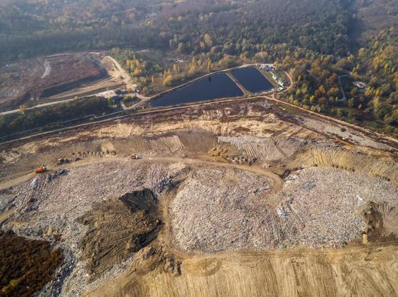 Aerial view of the big city dump. Smog formed in the sky.