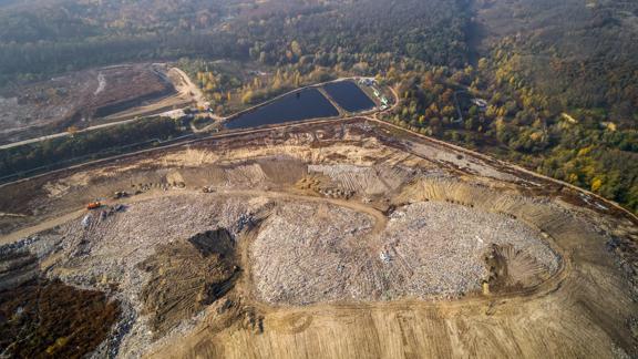 Aerial view of the big city dump. Smog formed in the sky.