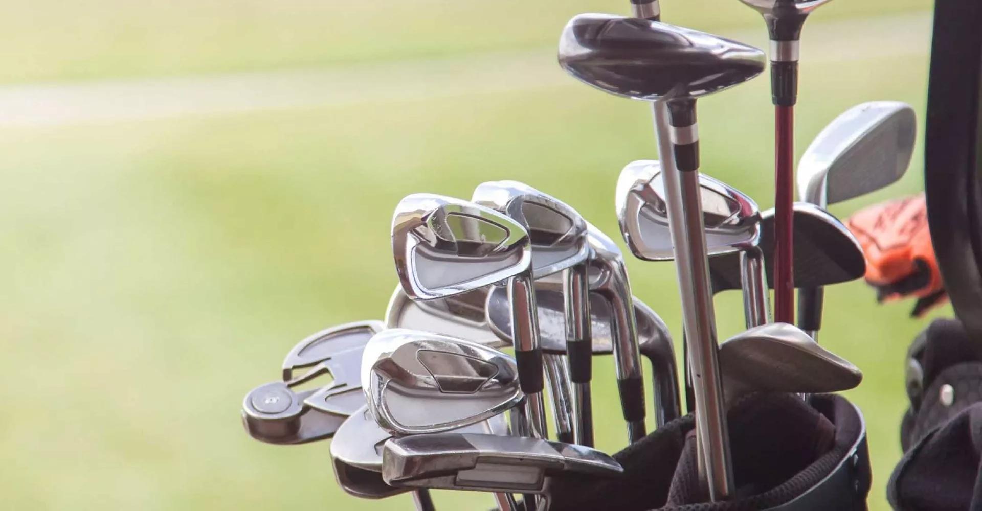 Close-up of golf irons.