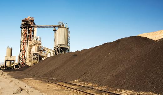 A cement works at Tehachapi Pass California, USA with coal stock piled.