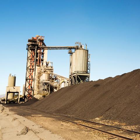 A cement works at Tehachapi Pass California, USA with coal stock piled.