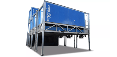 A blue and white Aggreko containerized industrial unit elevated on a steel framework.