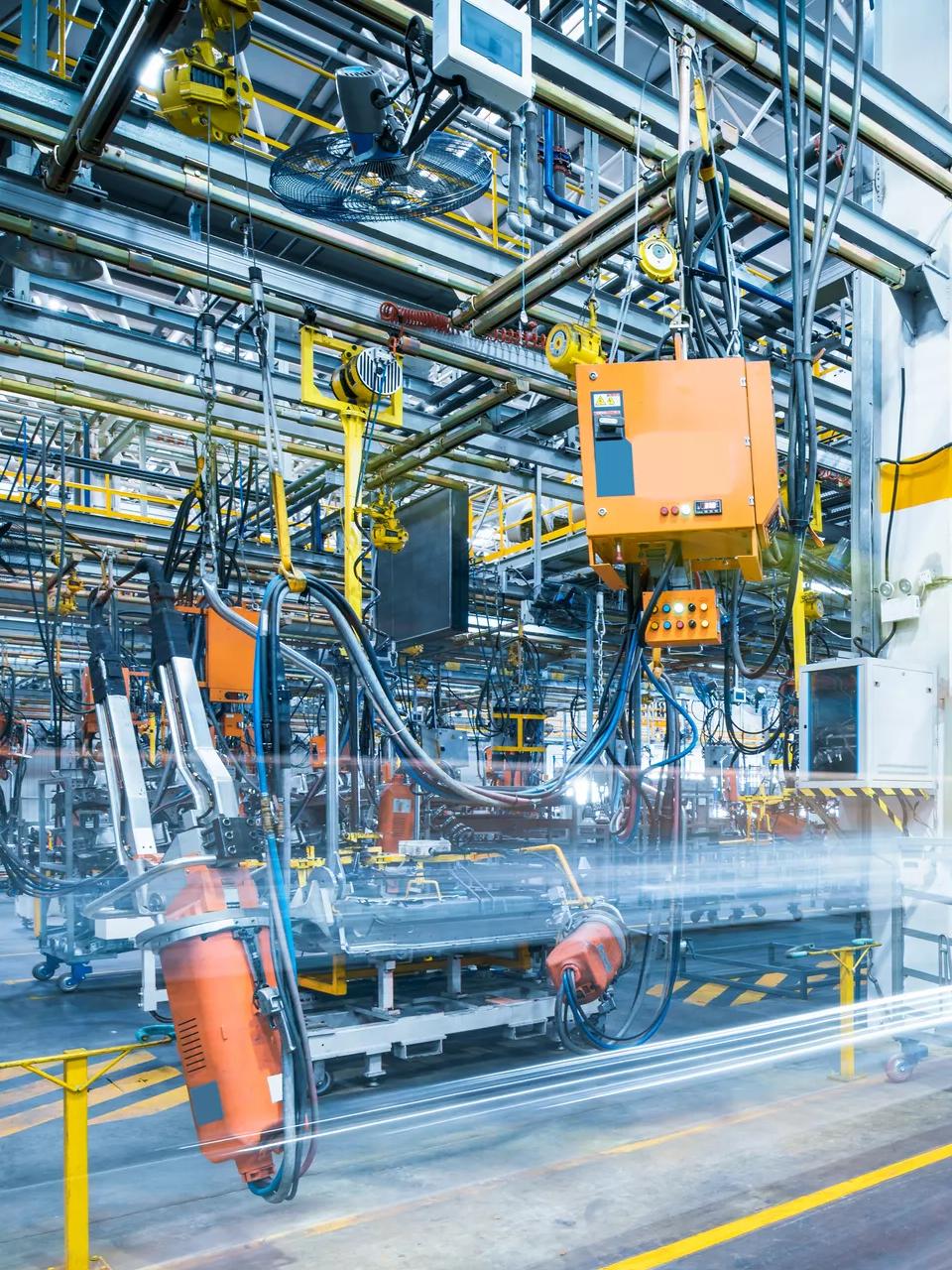 robots welding in a car factory