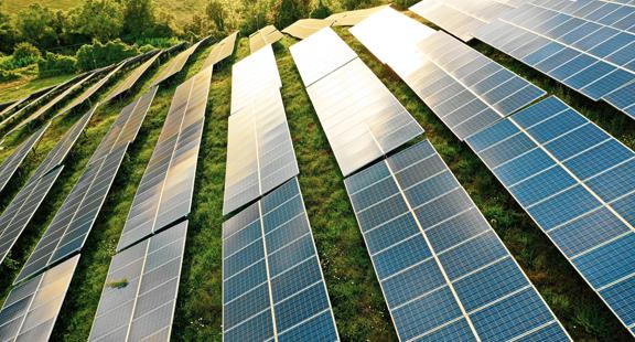 Solar panels fields on the green hills