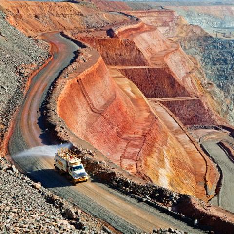 Water truck dampens road at KCGM mine (the Super Pit)