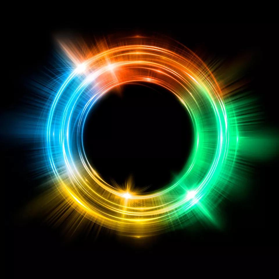 A bright multi-colored circle with a black background.