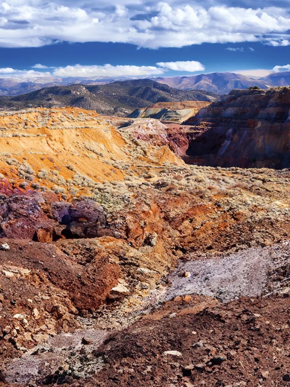 An aerial view of a rocky, earthy terrain