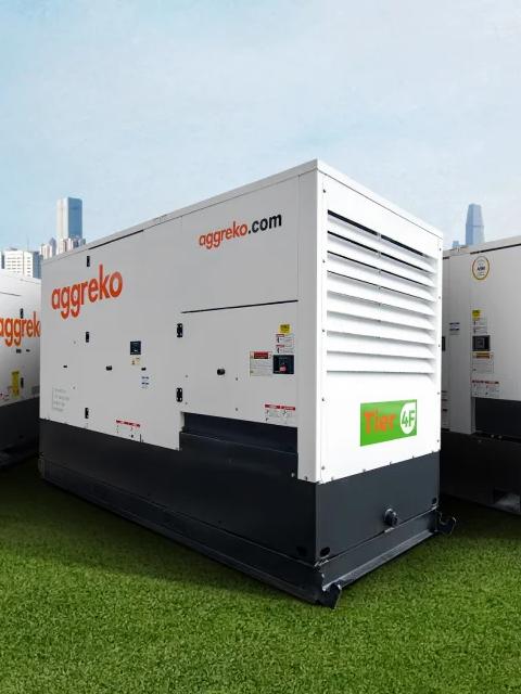 Generators sitting outdoors.