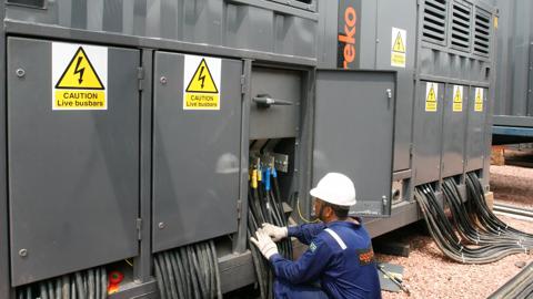 2008Nov-south-america-technician-working-aggreko-loadbank-utilities