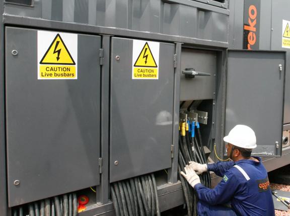 2008Nov-south-america-technician-working-aggreko-loadbank-utilities