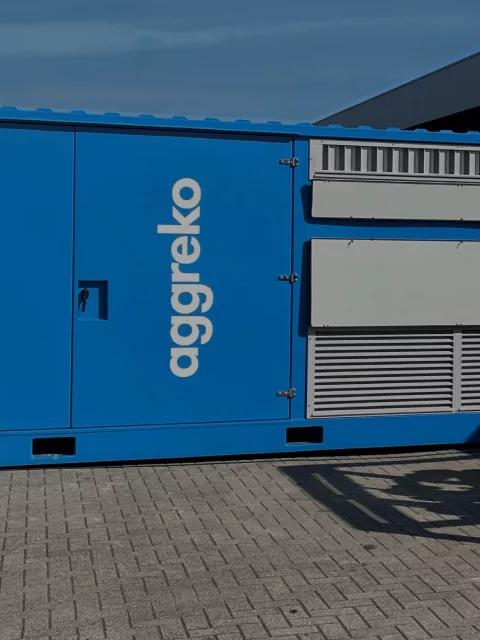 Aggreko industrial equipment and cooling system at an outdoor facility.
