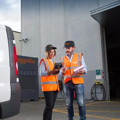 Employees at depot with van